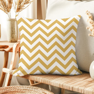 Almohada moderna de oro y blanco con chevron