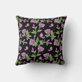 almohada negra con flores moradas