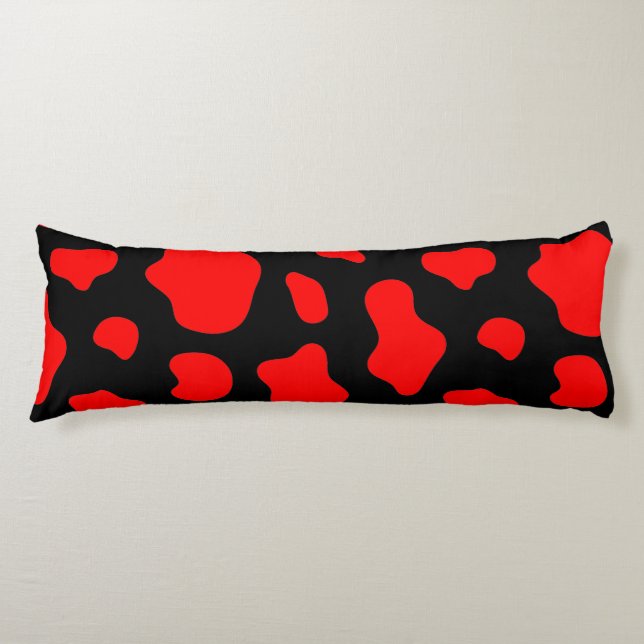 Almohada negra con manchas rojas. (Anverso)