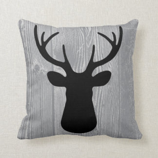 Almohada negra de madera gris de los ciervos