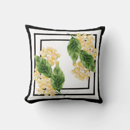 almohada negra y blanca con flores amarillas