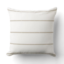 Almohada rayada de blancos y neutros