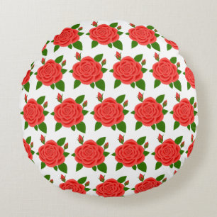 Almohada redonda blanca con rosa roja y capullos