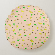 almohada redonda con motivos bananeros y palmeras