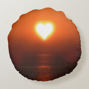 Almohada redonda de la puesta de sol del corazón