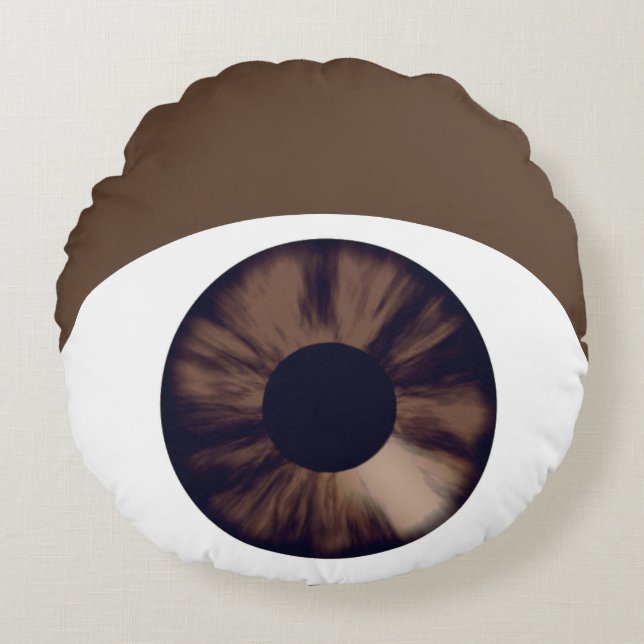 Almohada redonda de piel oscura de ojos marrones (Anverso)