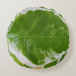 Almohada redonda texturada con diseño floral botán