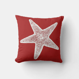 Almohada roja con las estrellas de mar