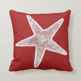 Almohada roja con las estrellas de mar