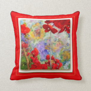 Almohada roja con los geranios rojos por Sharles