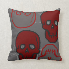 Almohada roja y gris de los cráneos