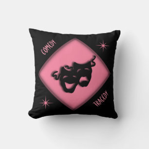 Almohada rosa con máscaras griegas felices y trist