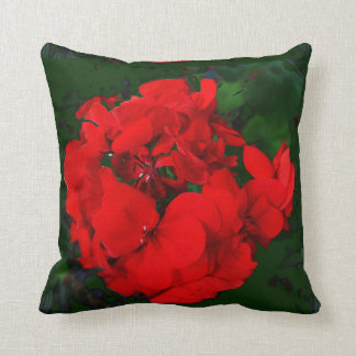 Almohada verde de los geranios rojos por Sharles