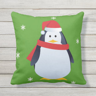 Almohada verde del navidad del pingüino