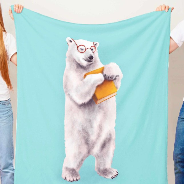Amante de libros de oso polar friki (blue blanket with a cute smiling polar bear with eyeglasses holding a yellow book, held in hands)