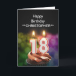 Añadir un nombre a las velas de esta tarjeta de 18<br><div class="desc">Quemando velas de pastel de 18 años en forma de números encima de un quequito de chocolate. Personalizar con el nombre de la persona de cumpleaños. Adecuado para un hombre o una mujer. Ver toda la gama de tarjetas para edades y relaciones en mi tienda. Todos los derechos de autor...</div>