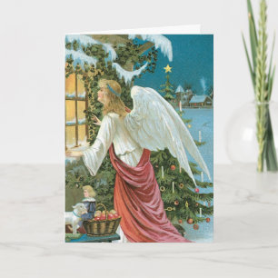 Ángel del navidad en la ventana