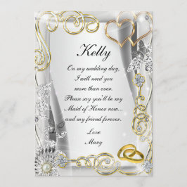 Anillos de boda de oro y tarjeta de dama de honor