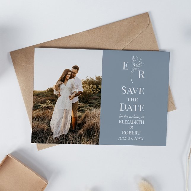 Anuncio de fecha de boda con foto y monograma flor (Dusty Blue Floral Monogram Custom Photo Wedding Invitation on white table with neutral decoration.)
