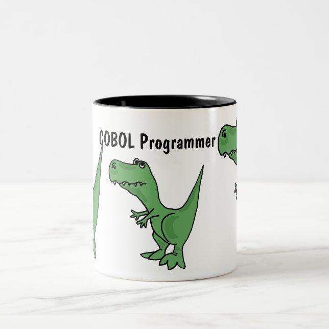 AQ- taza del dinosaurio del programador de COBOL (Centro)