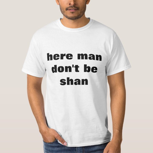 Aquí el hombre no es camiseta del shan (Anverso)