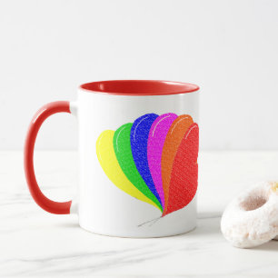 Arcoiris de los globos cardíacos en la taza del c