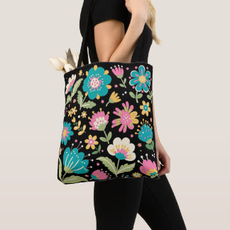 Arte popular bonito en bolsa de mano negra.
