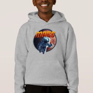 Astronauta frente al planeta Marte.