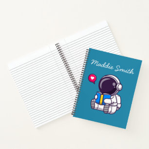 Astronauta leyendo libro niños lindos