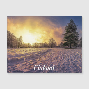 Atardecer sobre el imán de parque de invierno neva