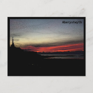Atardecer sobre el mar en la postal de Aberystwyth