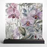 Azulejo Bloques de orquídeas de lavanda rosa y morada past<br><div class="desc">Transforme su espacio con la elegancia y belleza de nuestro exquisito azulejo cerámico, con un impresionante diseño de orquídeas delicadas. Esta baldosa combina armoniosamente tonos pastel suaves con grandes y minuciosamente detalladas flores de orquídeas en tonos rosa y lavanda. Las flores se complementan con hojas verdes mudas y exuberantes, creando...</div>