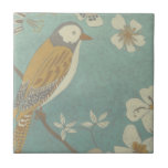 Azulejo De Cerámica Ave amarillo, gris y beige encaramado en una rama<br><div class="desc">Chariklia Zarris es conocida por sus obras de arte abstracto. En este dibujo de un perfil de un pájaro sobre un fondo verde azulado azul,  ella capturó la simplicidad del pájaro. Las flores blancas le dan un toque romántico. Personalizar tu producto Zazzle favorito usando esta hermosa imagen.</div>