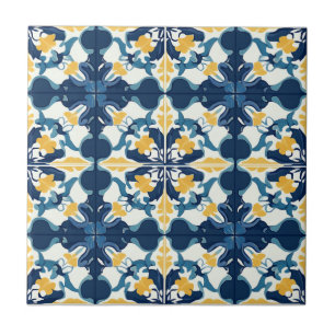 Azulejo de cerámica con patrón azul y dorado