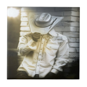 Azulejo De Cerámica Vaquero aguantando a su Gorra