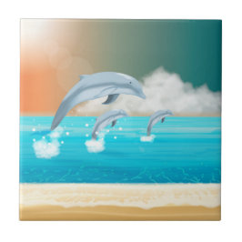 Azulejo delfines saltando en el océano