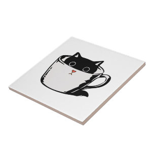 Azulejo Gatito negro con nariz roja escondido en una taza
