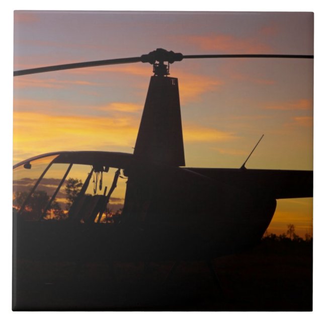 Azulejo helicóptero Robinson R44 al atardecer (Frente)