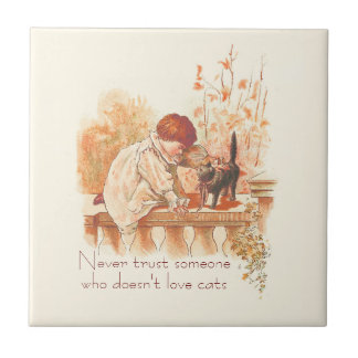 Azulejo Hermoso niño rojo haitiano con una cita para gato 