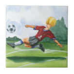 Azulejo Jugador de fútbol pateando una pelota por Jay Thro<br><div class="desc">Una pelota de fútbol cuelga en el aire,  esperando la patada viciosa que el jugador está sacudiendo para entregar. ¿Puede doblarlo como Beckham? ¡Una bonita pieza para colgar la pared o para regalar a los aficionados al fútbol en tu vida!</div>