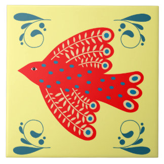 Azulejo pájaro rojo folklórico sobre fondo amarillo a la d