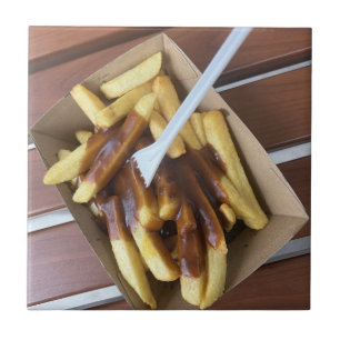 Azulejo Papas calientes empapadas en salsa y sal de pollo