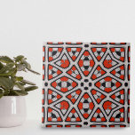 Azulejo Patrón geométrico simétrico rojo negro negrita<br><div class="desc">El diseño de esta baldosa cerámica se compone principalmente de formas simétricas, siendo los diamantes y las estrellas los más notables. Cada forma se rellena con complejos patrones internos, añadiendo una capa de complejidad al diseño general. La combinación de colores es audaz y llamativa, con elementos rojos vibrantes delineados en...</div>
