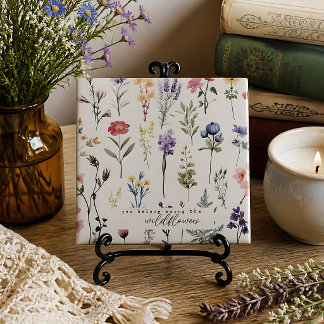 Azulejo Perteneces entre las flores silvestres