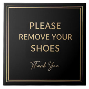 Azulejo Señal de quitarse los zapatos negro y dorado