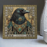 Azulejo Tribal personalizada con espíritu de avena mística<br><div class="desc">Embarque en un viaje místico con nuestra cerámica de "Espíritu místico de avena". El diseño presenta un majestuoso Raven, resplandeciente con joyas tribales, capturado en perfecta armonía simétrica. Los colores son abundantes y reconfortantes, con tonos verde oscuro, marrón, dorado y aguamarina oscura, que crean una sensación que recuerda a un...</div>