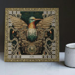 Azulejo Tributo a las joyas tribales de Mystical Hummingbi<br><div class="desc">Entrar en un reino donde convergen lo físico y lo espiritual con nuestra meticulosamente elaborada 'Mistical Hummingbird Tribal Jewel Ceramic Tile'. Inspirada por una amalgama de estilos de arte únicos -estética tribal, optimismo feliz, rebelión en el punk de la alfombra y armonía simétrica-, esta baldosa resuena con una rica narrativa...</div>