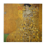 Azulejo Vestido dorado de Art Lady | Gustav Klimt<br><div class="desc">Inspirada en las icónicas obras de arte de Gustav Klimt, esta cerámica presenta un diseño que muestra a una mujer de arte con un vestido dorado y colorido, irradiando elegancia y encanto. Perfecto para los amantes del arte, los amantes de la moda y los que aprecian una decoración única y...</div>