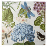 Azulejo Vintage floral Jardín de la Flor de Dragón Botánic<br><div class="desc">#5 de 5 imágenes coordinadas en mosaico. La libélula azul profunda roba el espectáculo en este collage con flor botánica azul hidrangea, mariposa, mosca, gloria matutina y escritura a mano ephemera e imágenes publicitarias antiguas sobre un fondo crema suave, marfil texturado. Collage creado y diseñado de forma gráfica por la...</div>