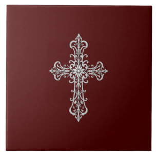 Azulejos de cerámica roja oscura con cruz plateada